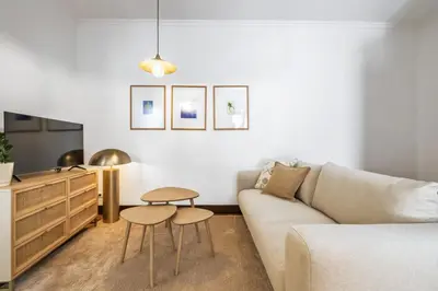 a living room with a couch and a table at Zino Apartment B - By Wehost in Funchal