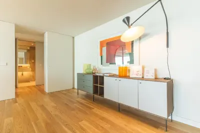 a bedroom with a large white bed and a couch at Monumental Sea&Sky by Atlantic Holiday in Funchal