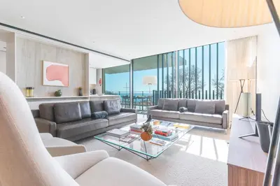 a living room with a couch and a tv at Monumental Sea&Sky by Atlantic Holiday in Funchal
