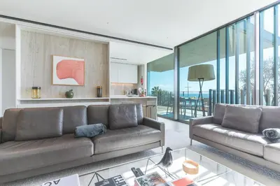 a dining room with a glass table and a mirror at Monumental Sea&Sky by Atlantic Holiday in Funchal