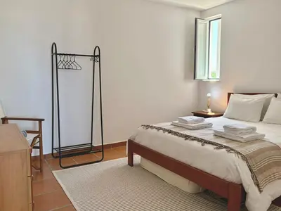 a bedroom with a bed with a basketball hoop at Casa Sul in Sagres