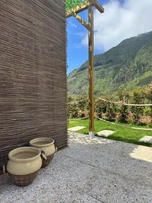 a view of a village with mountains in the background at The Green Valley House II in São Vicente