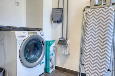 a washer and dryer in a laundry room at The Place Funchal View, a Home in Madeira in Funchal