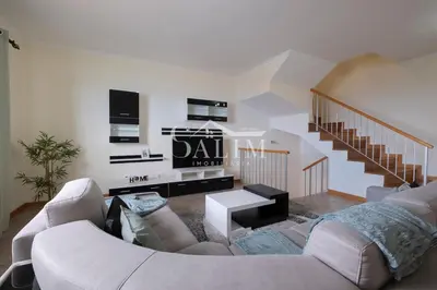 a living room with a couch and a staircase at Casa Pereira by SALIM in Santa Cruz