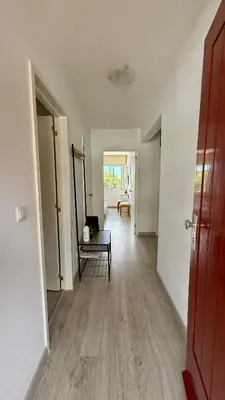 an empty room with a hallway with a table in it at Nazaré Stay in Funchal