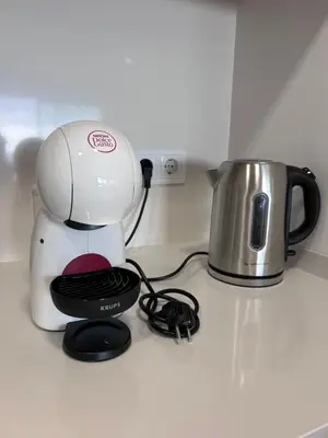 a coffee maker on a counter next to a kettle at Saraiva Hills Ocean View Penthouse in Câmara de Lobos