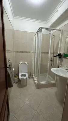 a bathroom with a shower and a toilet and a sink at Sea View Retreat in Caniço