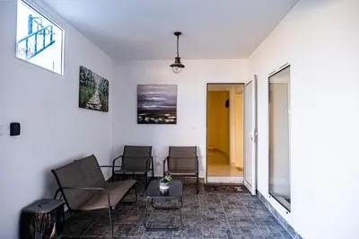 a room with chairs and a table and a window at Picturesque stay Porto da Cruz in Porto da Cruz
