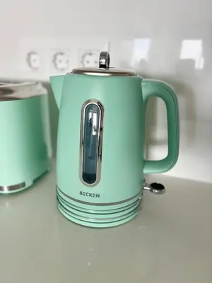 a blue electric kettle sitting on a kitchen counter at Dream Home - everything you deserve! in Funchal