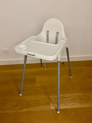 a white chair sitting on top of a wooden floor at Dream Home - everything you deserve! in Funchal