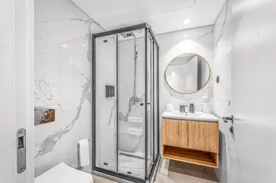 a bathroom with a shower and a sink at Sao Lucas Apartment Top Location in Funchal