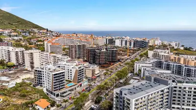an aerial view of a city with the ocean at Sao Lucas Apartment Top Location in Funchal