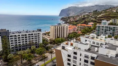 an aerial view of a city and the ocean at Sao Lucas Apartment Top Location in Funchal