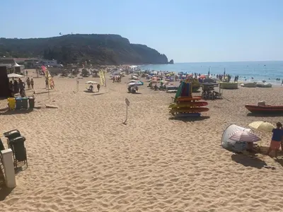 a beach with a lot of people on it at MarLuz in Luz