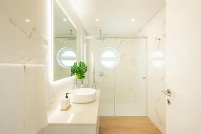 a white bathroom with a sink and a shower at Tropical Beach Villa by Blue Diamond 21 in Lagos