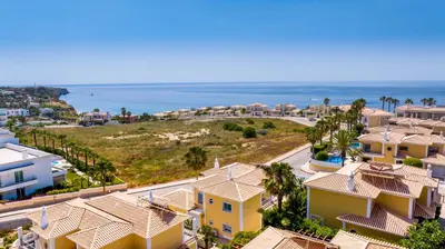 an aerial view of houses and the ocean at Tropical Beach Villa by Blue Diamond 21 in Lagos