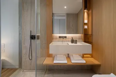 a bathroom with a sink and a shower at Savoy Monumentalis V by An Island Apart in Funchal