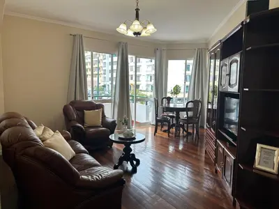 a living room with a couch and a television at Robert Apartment in Ajuda in Funchal