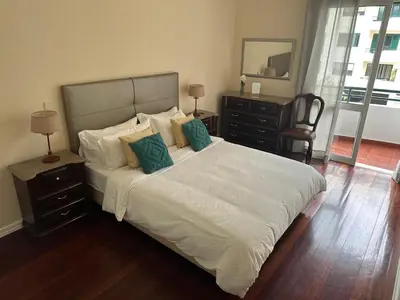 a bedroom with a bed with white sheets and pillows at Robert Apartment in Ajuda in Funchal