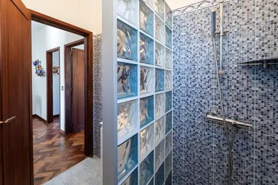 a bathroom with a toilet and a sink and a mirror at Sailor House - By Wehost in Porto Santo