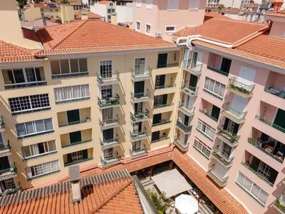 an overhead view of a building with red tile roofs at Funchal Heart Studio in Funchal