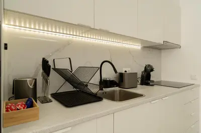 a kitchen counter top with a sink and a counter top at Funchal Heart Studio in Funchal