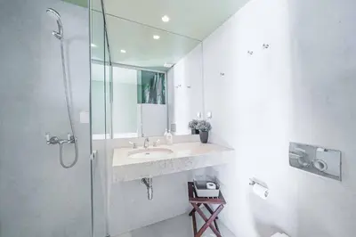 a bathroom with a sink and a shower at Villa Fig Tree in Prazeres