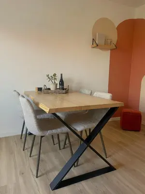 a dining room table with two chairs and a wooden table at Calheta Suites - Vinha & Jardim - Adults-only suites met hottub & zeezicht in Calheta