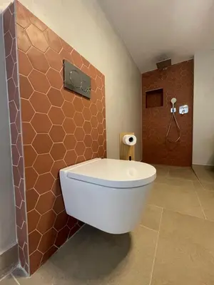 a bathroom with a toilet and a shower at Calheta Suites - Vinha & Jardim - Adults-only suites met hottub & zeezicht in Calheta
