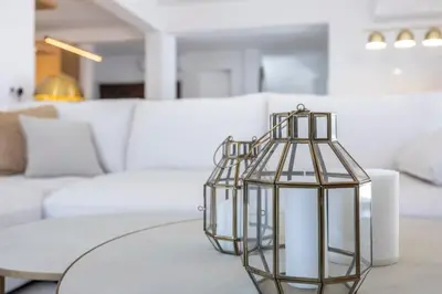 a glass lantern sitting on a table in a living room at Alba Villa in Aljezur