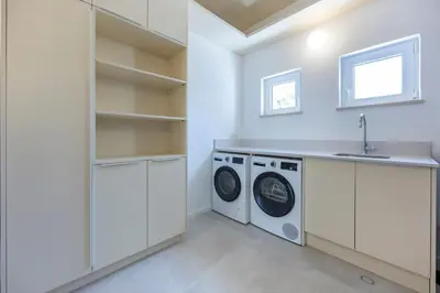 a white laundry room with a washer and dryer at Alba Villa in Aljezur