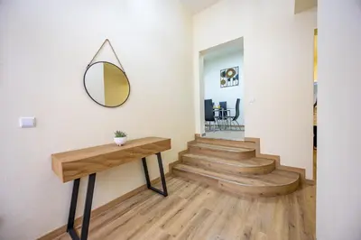 a hallway with stairs and a mirror on the wall at Serenity View by YOUR KEY in Funchal