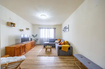 a living room with a couch and a tv at Serenity View by YOUR KEY in Funchal