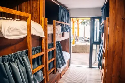 a room with two bunk beds in a house at North Madeira Guesthouse in Seixal