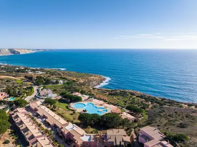 an aerial view of a resort next to the ocean at The Oceanfront Villa Luz VR114 in Luz