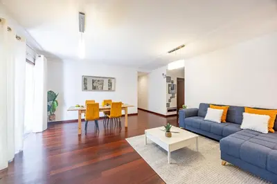 a living room with a couch and a table at Secret Stay Funchal by YOUR KEY in Funchal