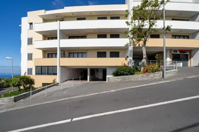 an empty street in front of a building at Lobos Horizon by An Island Apart in Câmara de Lobos