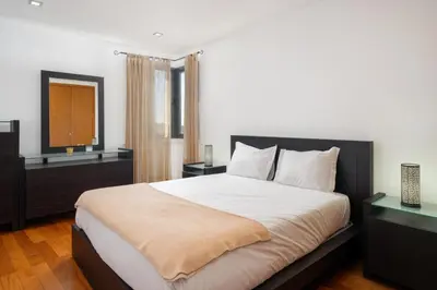 a bedroom with a large bed and a television at Lobos Horizon by An Island Apart in Câmara de Lobos