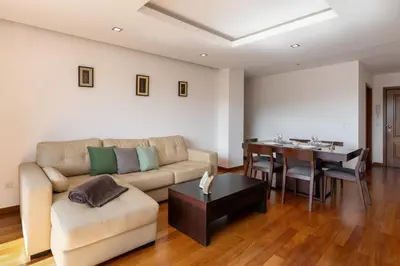 a living room with a couch and a table at Lobos Horizon by An Island Apart in Câmara de Lobos