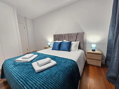 a bedroom with a bed with two towels on it at Santa Cruz Center by Rentallido in Santa Cruz