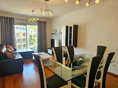 a dining room with a glass table and chairs at Concórdia Apartment by Rentallido in Funchal