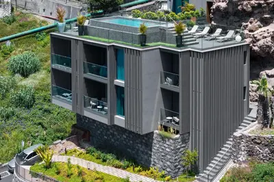 an aerial view of a building with a swimming pool at Calheta Hills I by An Island Apart in Calheta