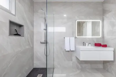 a white bathroom with a sink and a shower at Villa Oceano Sereno by GALMI in Ponta do Sol