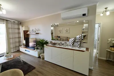 a bathroom with a sink and a mirror at Madalena Sunset by Mill Escapes in Madalena do Mar