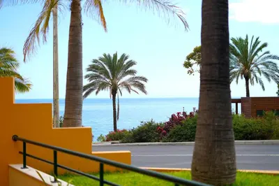a view of the ocean from the balcony of a resort at Madalena Sunset by Mill Escapes in Madalena do Mar