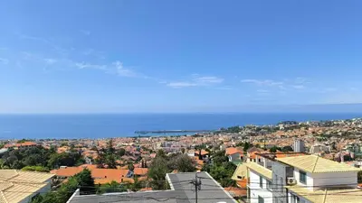 a view of a city with the ocean in the background at Consolação Sea View in Funchal