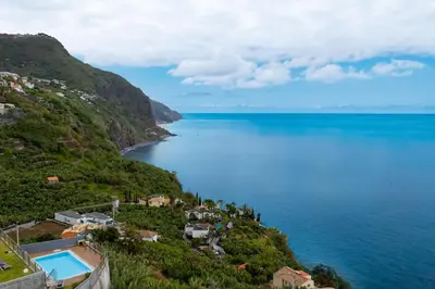 a view of the ocean from a hill at Fajã Stone House by LovelyStay in Arco da Calheta