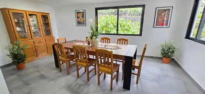a dining room with a table and chairs at Annamoraj by Eurostay - Nature's peace - Your cozy escape! in Ribeira Brava