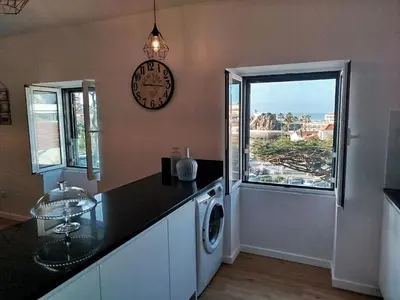 a bathroom with a toilet and a sink and a shower at Baía dos Lobos in Câmara de Lobos