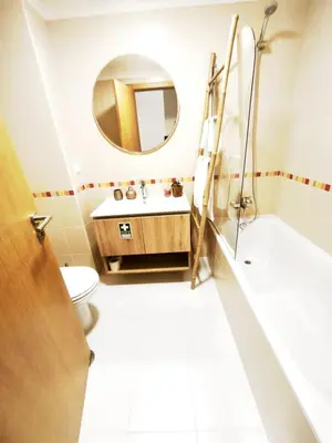 a bathroom with a sink and a mirror at Art House Madeira II in Caniço